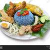 Nasi Kerabu  (Fried Chicken Served With Blue Rice,Egg & Keropok)